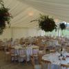 Hanging baskets in wedding marquee